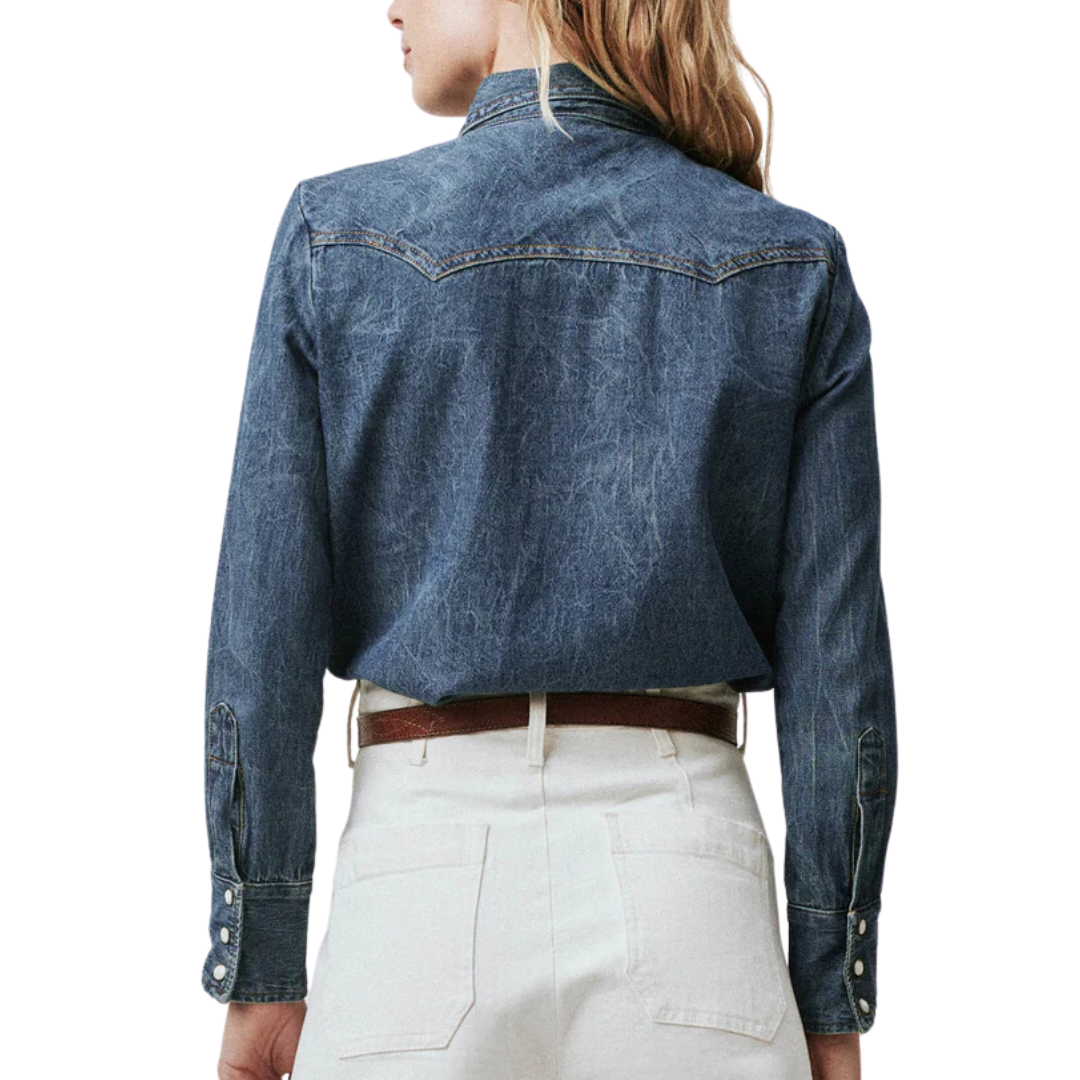 The Great Howdy Top denim western shirt back view on model with white pants