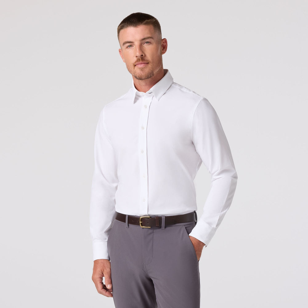 Mizzen & Main Leeward long sleeve white dress shirt worn by male model with gray pants
