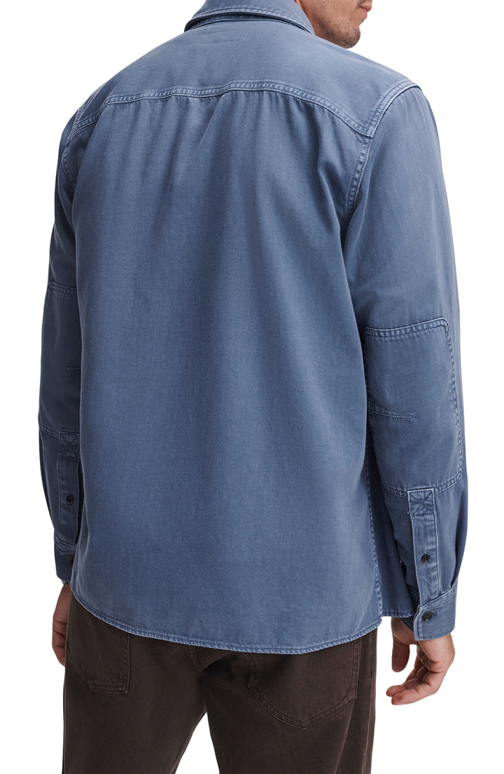 Back view of Rag & Bone overdyed blue denim workwear shirt with utility details