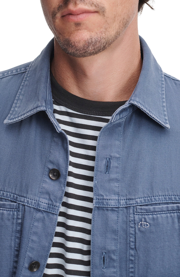 Rag & Bone overdyed blue denim workwear shirt jacket with button closure on male model