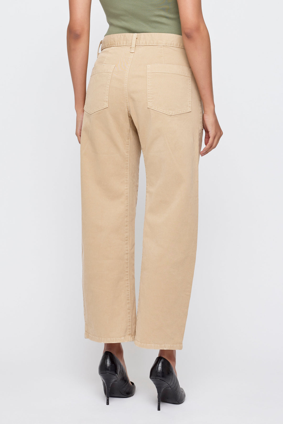 Back view of beige wide-leg cargo pants worn with black heels and olive top