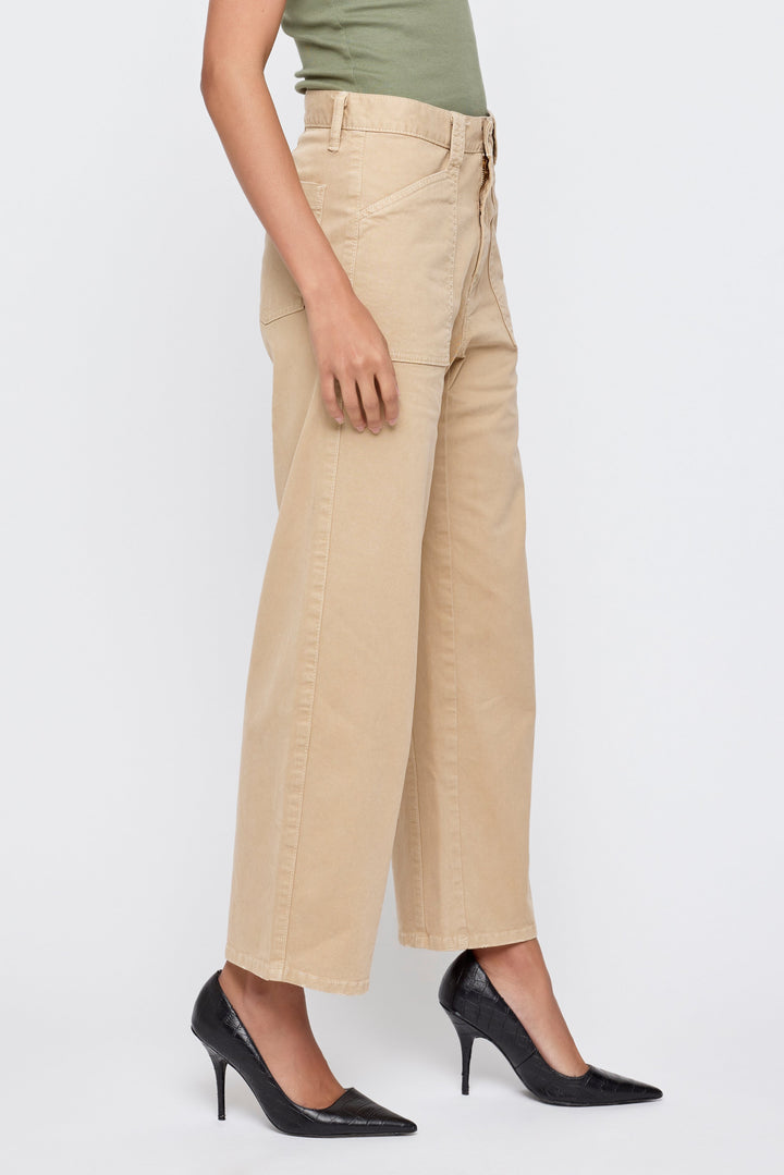 Women's wide-leg khaki cargo pants with patch pockets styled with black heels
