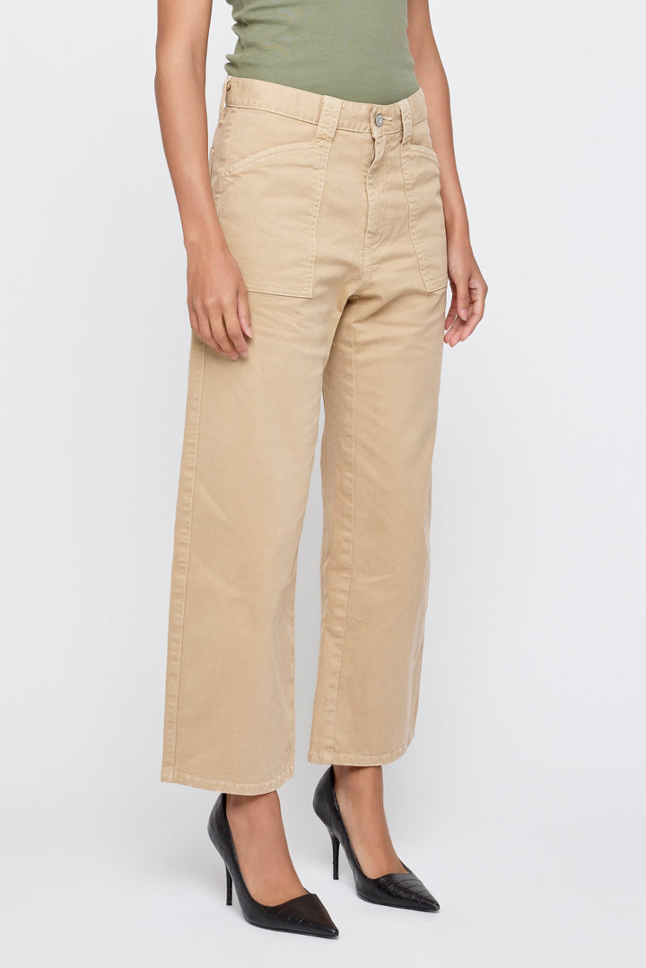 Women's khaki wide-leg cargo pants with patch pockets styled with black heels