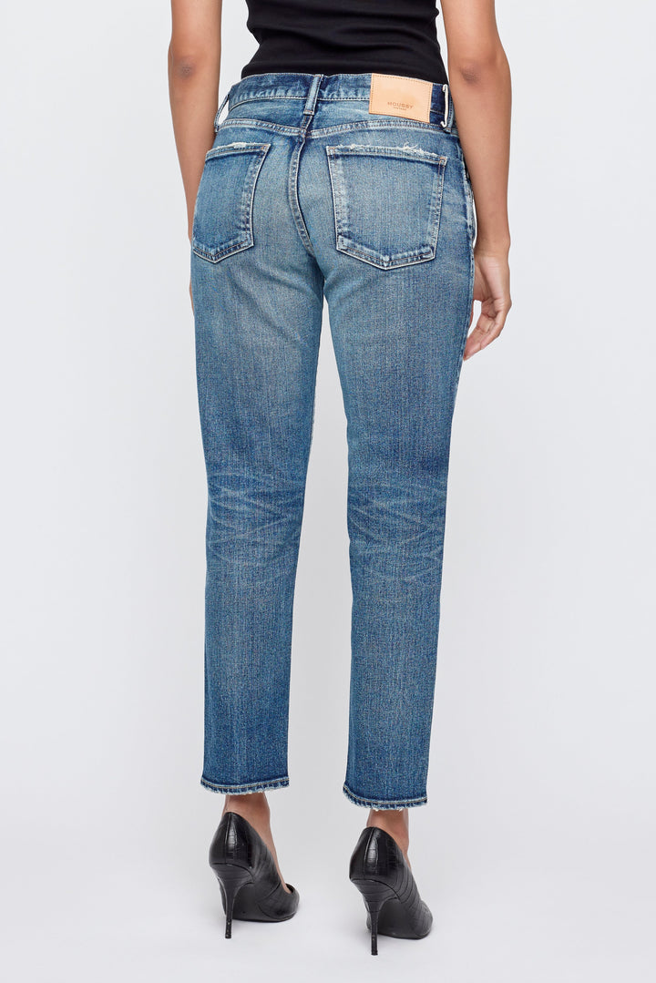 Moussy Vintage Alice tapered jeans shown from back on model with black top and heels