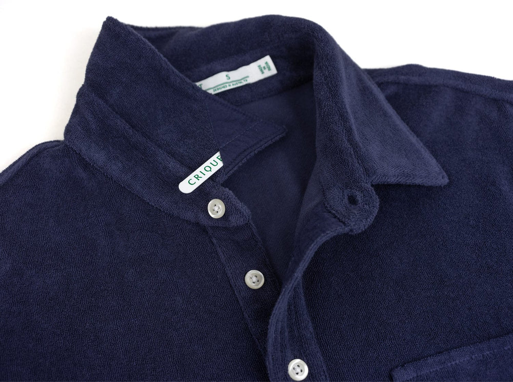 Navy blue Criquet terrycloth players shirt with white buttons and collar detail