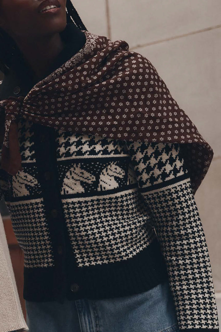 The Great Pony Cardigan in black and cream Fair Isle knit with houndstooth pattern and brown floral scarf