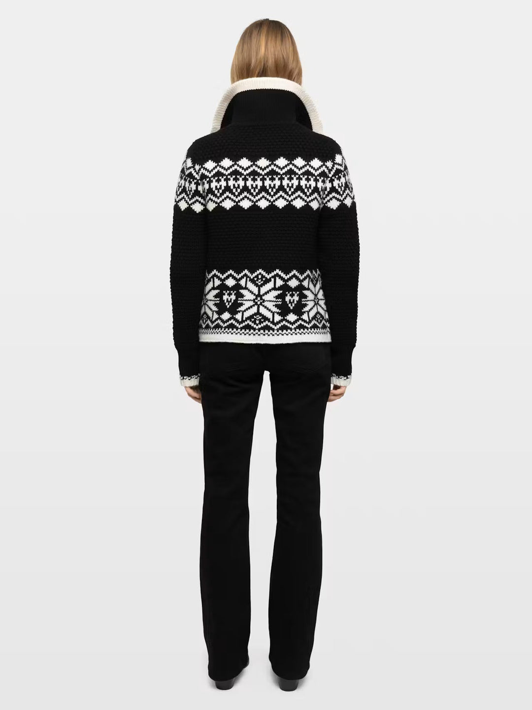 Black and white Fair Isle knit sweater with Nordic pattern shown from back view