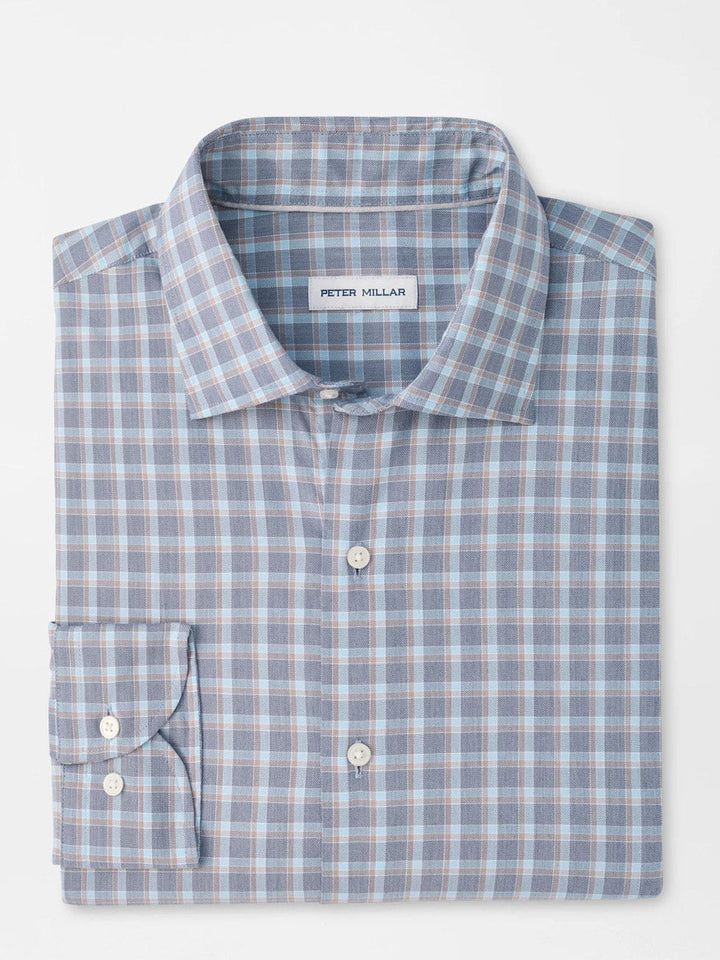 Peter Millar plaid dress shirt in blue and tan folded on white background