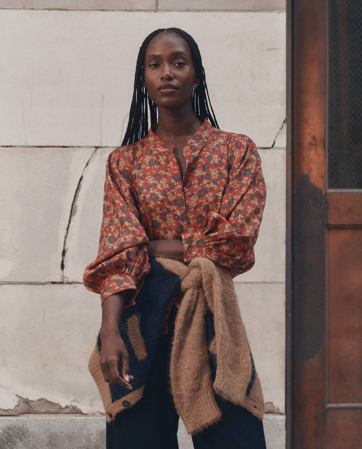 The Great Ashland Top in rust red floral print with puffed sleeves and v-neckline