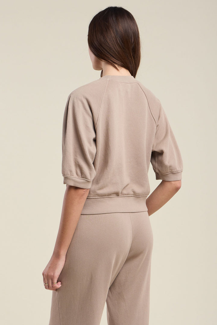 Back view of taupe short-sleeve cropped sweatshirt with ribbed hem and cuffs